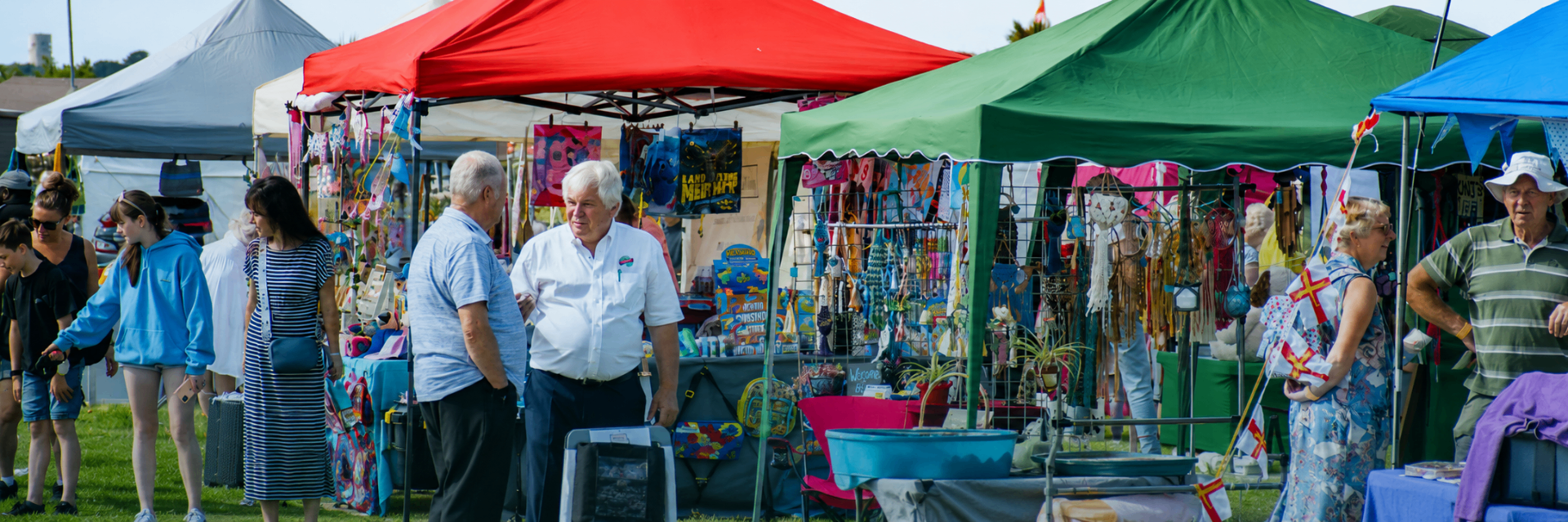 Colourful trader tents and visitors at the showground